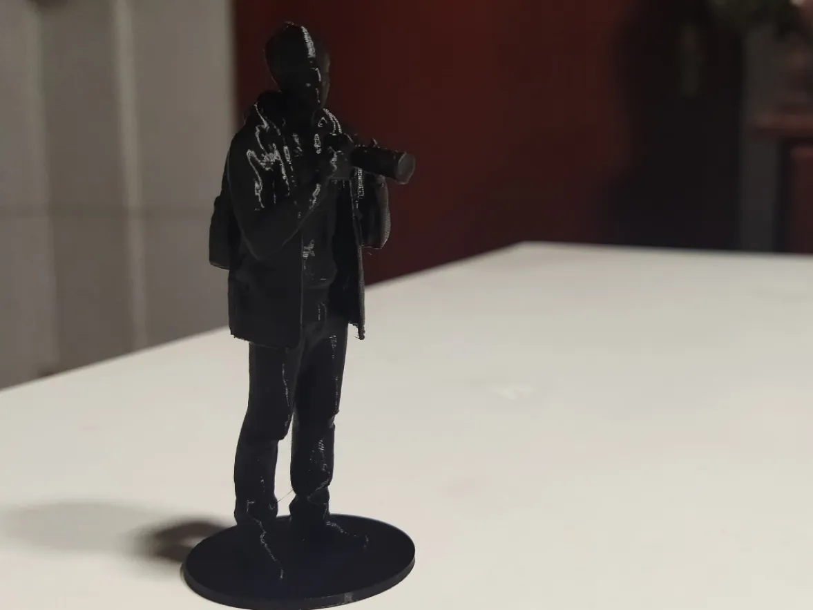 Figurine photographe avec socle