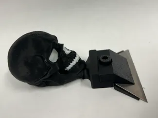 Over-engineered Skull razor scraper
