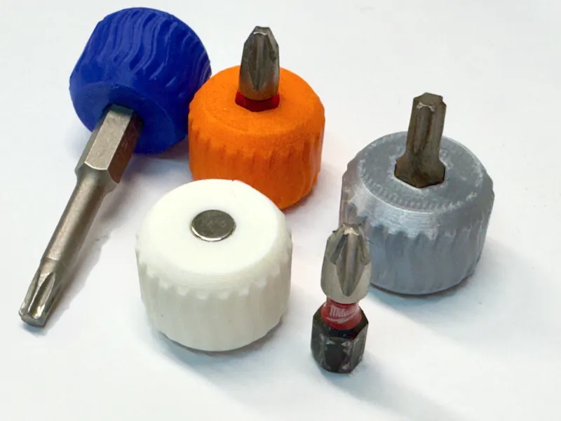 Tiny screwdriver handle with magnet bit retention.