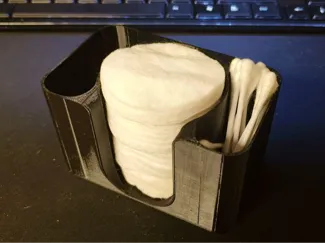 A box of cotton pads and sticks