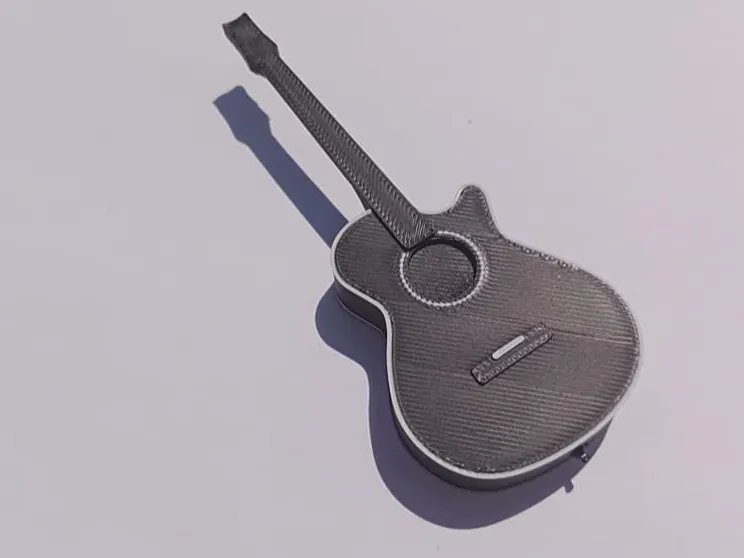 Guitar shaped pick holder