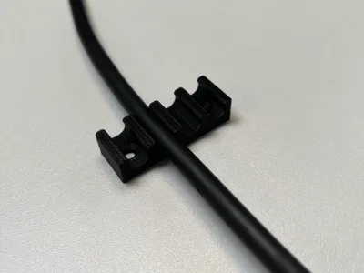 Cable clamp for two, three, and four cables