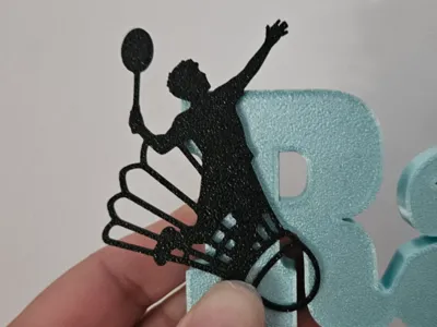 badminton boy smashing figurine