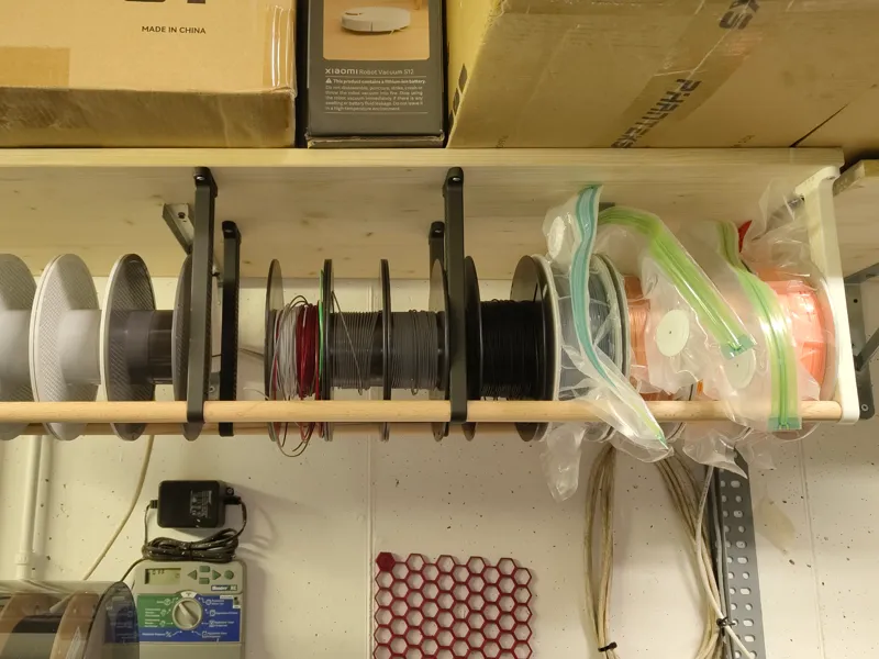 Under shelf / cealing mounted spool storage