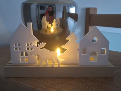Stand with house, moose, and Christmas tree