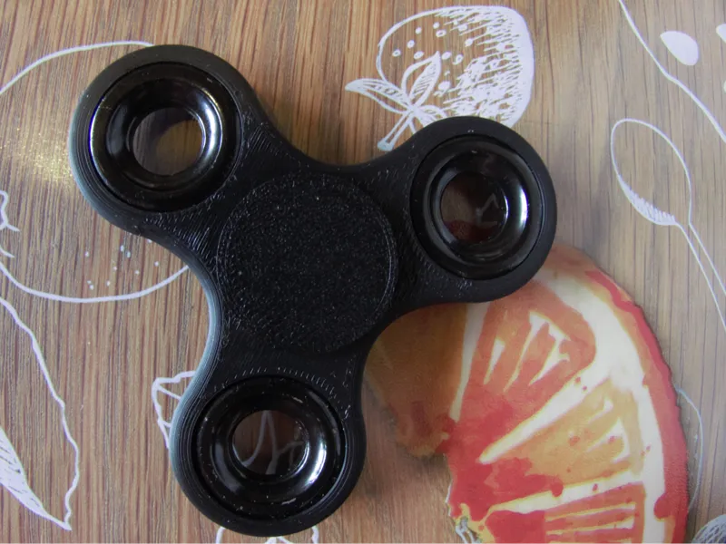 Fidget spinner with weights