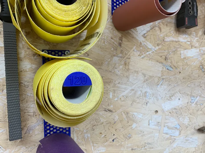 Sand paper roll holder