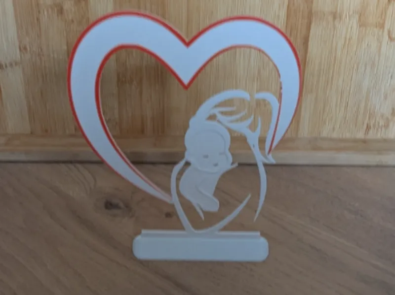 Décoration mère avec son bébé dans un coeur