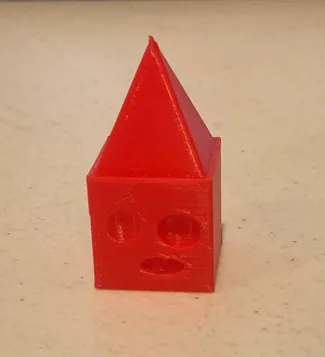 Cube with a pyramid on its head looking confused