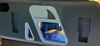 Shark side panel for AMS riser