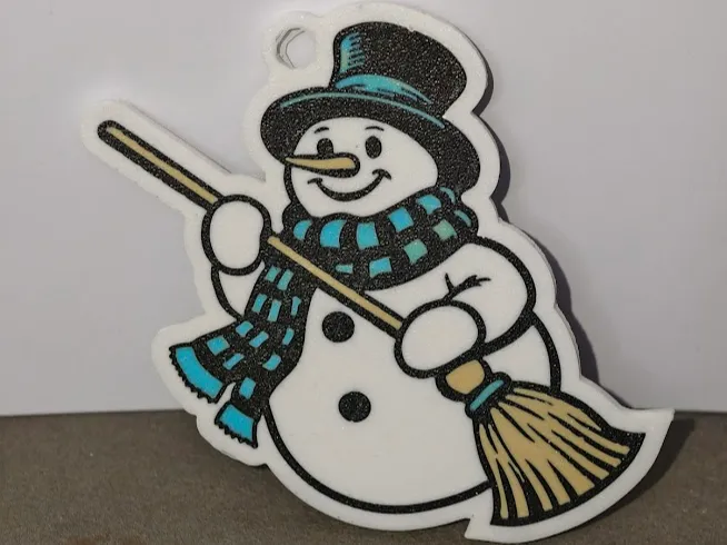 Snowman with a broom