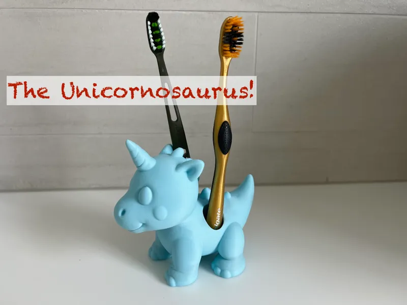 Dinosaur unicorn toothbrush holder