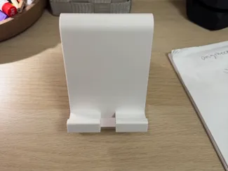 A simple phone stand with charger cutout