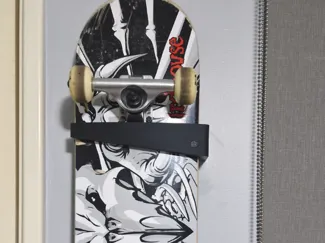 Skateboard vertically oriented wall mount bracket