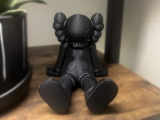 Kaws Sitting
