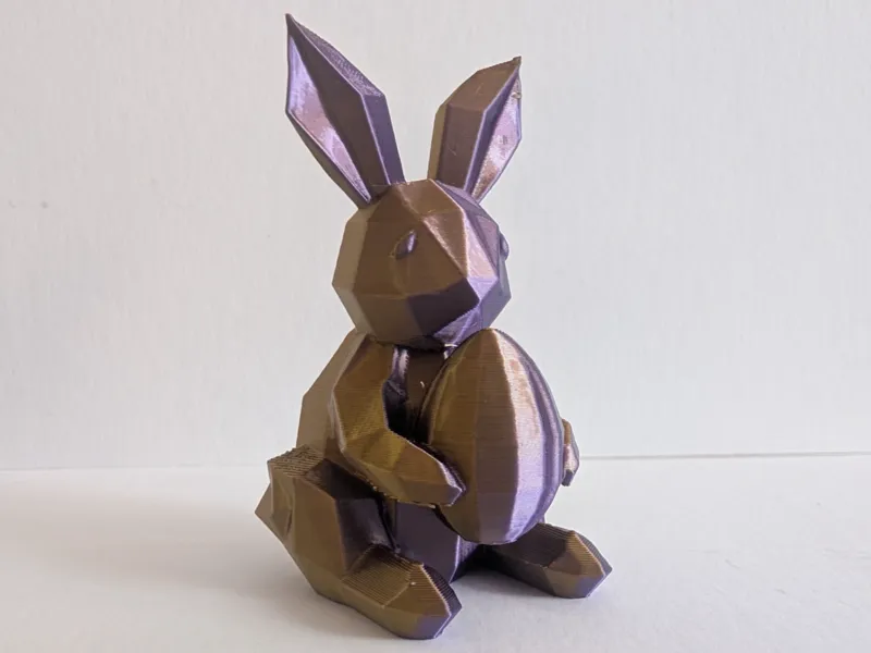 Low Poly Easter bunny holding an Egg