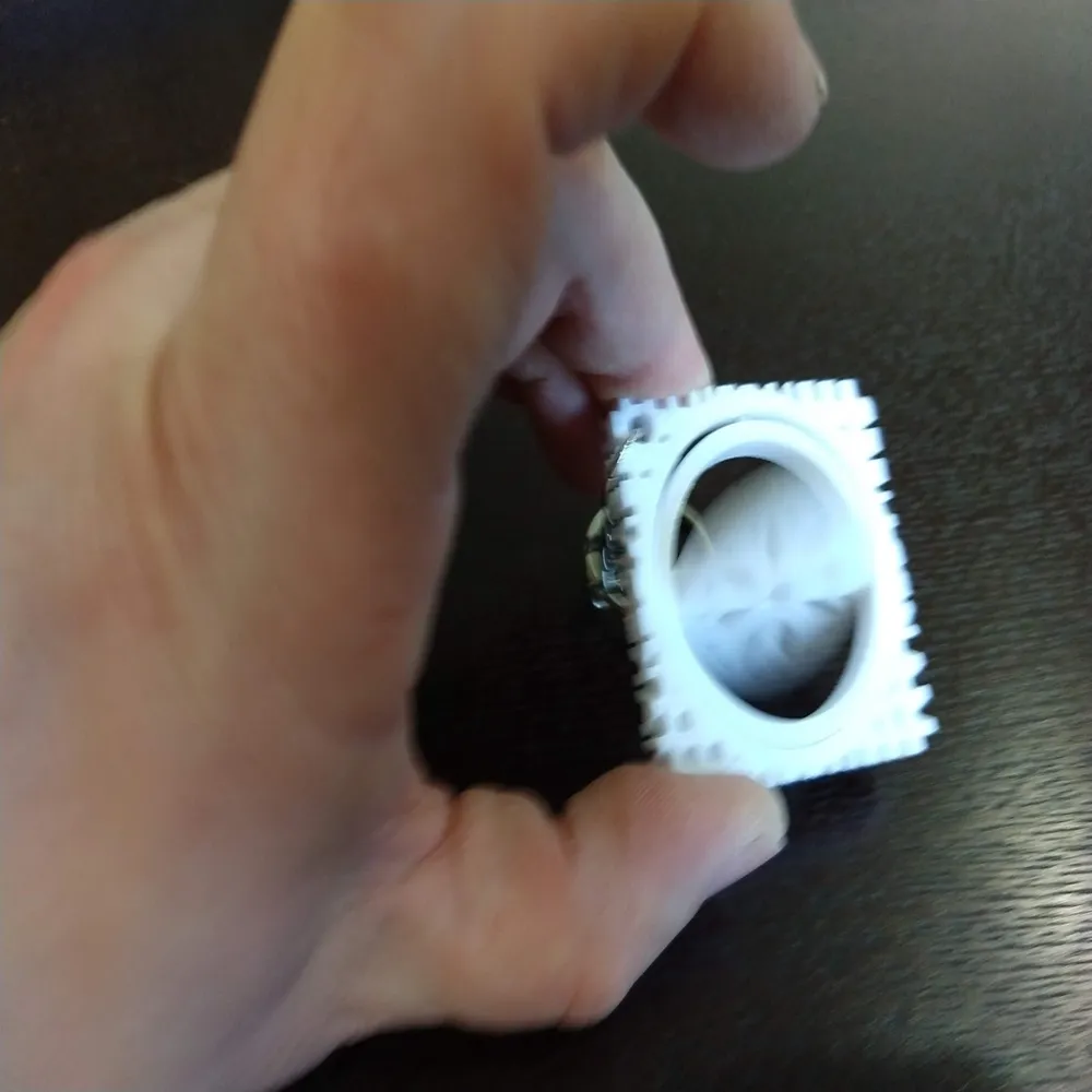 Winter Holiday Snowflake Gimbal Keychain By Makerneer MakerWorld winter-holiday-snowflake-gimbal-keychain-by-makerneer-makerworld