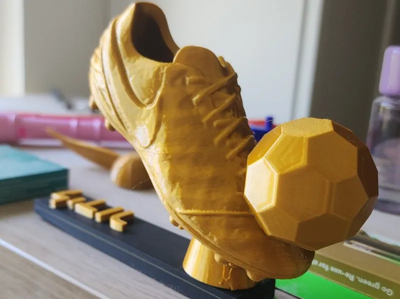 soccer boot with ball trophy