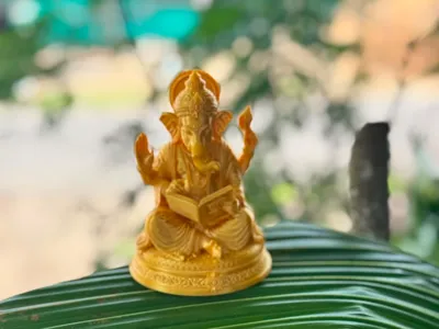 Ganesh Statue Writing on Book