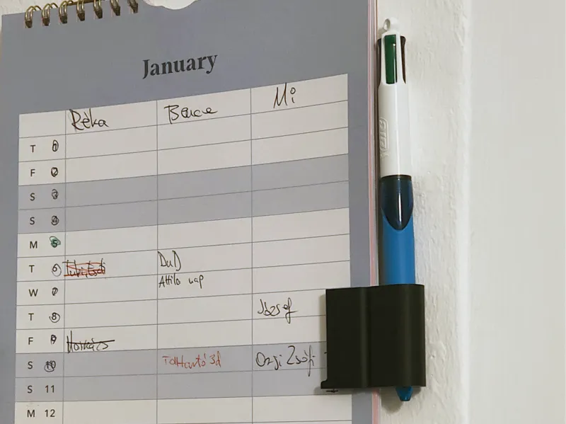 Calendar clip pen holder