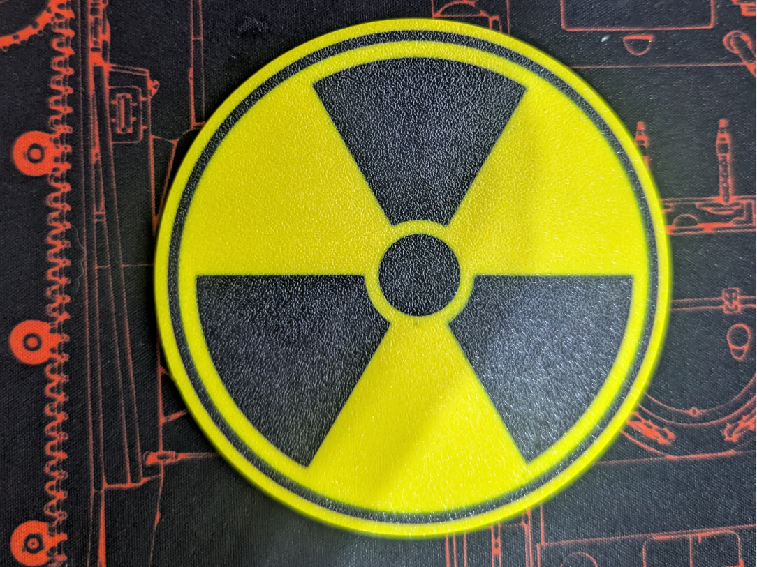 Radiation symbol coasters and coaster holder