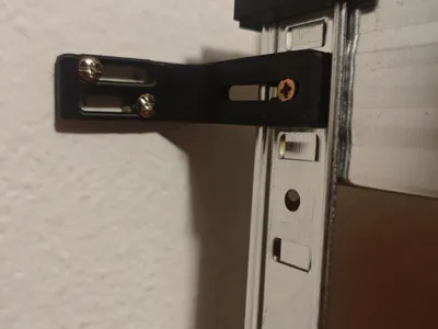 Angled wall holder with screw holes
