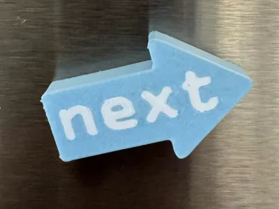 “next” refrigerator magnet