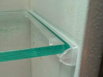 Shelf holder for mirror cabinet