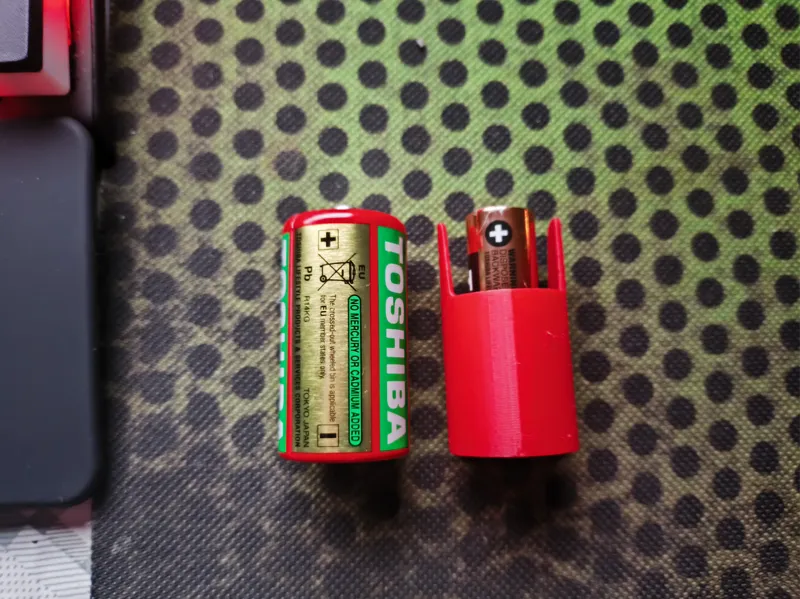 Battery adapter LR06/AA to R14/C