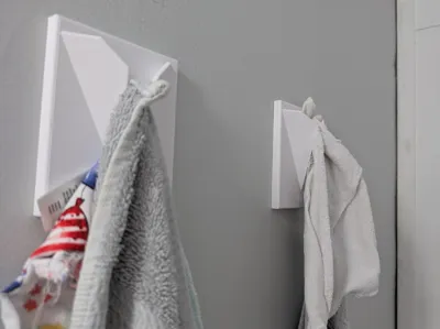 Bathroom Towel Holder With holes for wall mounts.