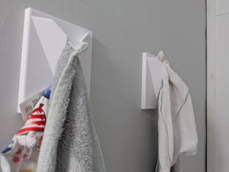 Bathroom Towel Holder With holes for wall mounts.
