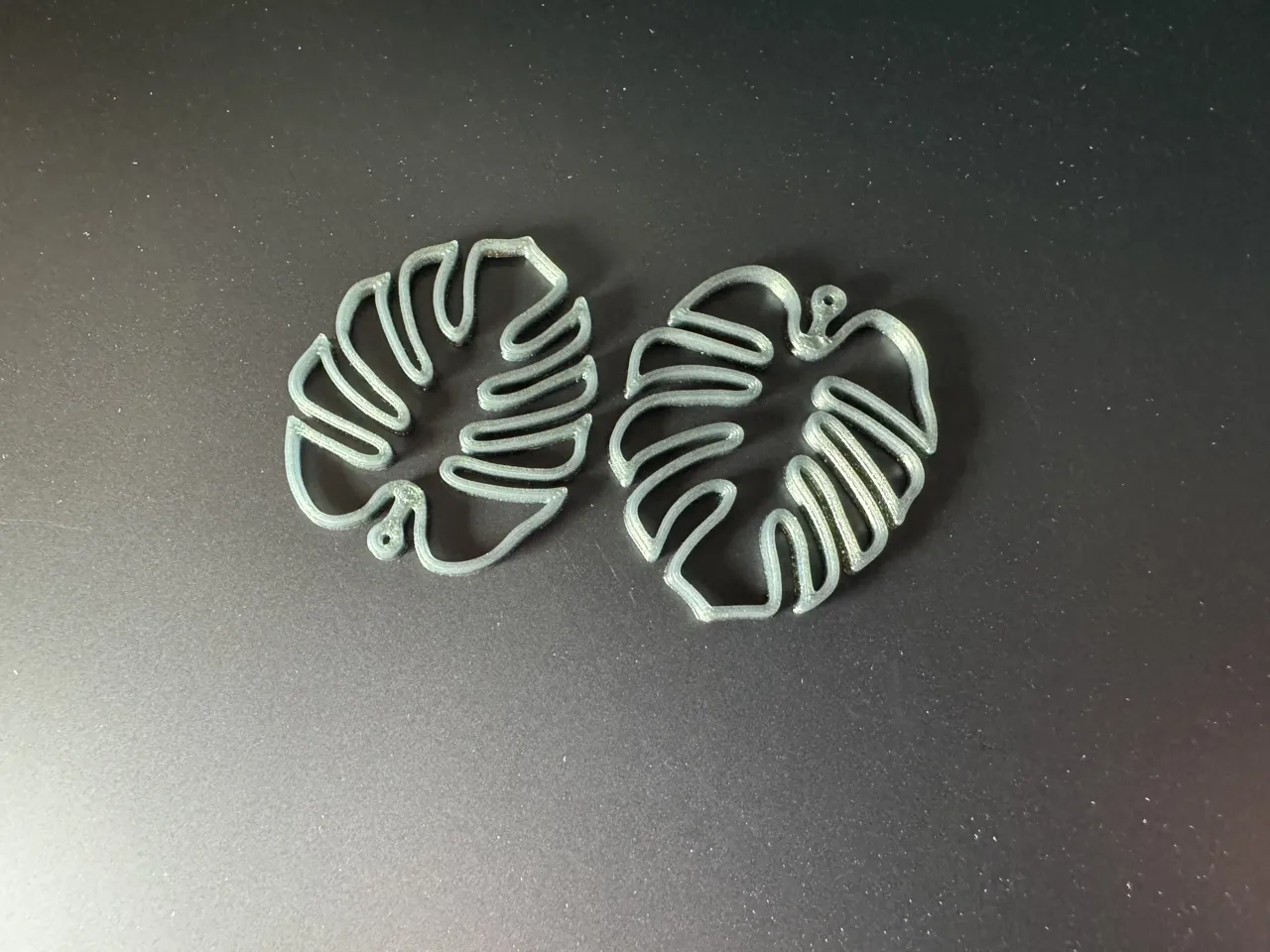 Monstera leaf line earrings view 2