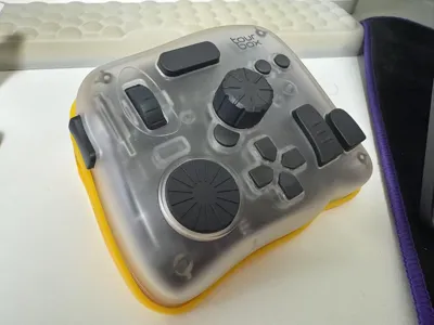 Based on the Tourbox ergonomic stand, adapted for the Tourbox Elite Plus modifier