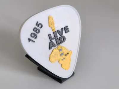 Live Aid logo in the shape of a guitar pick 