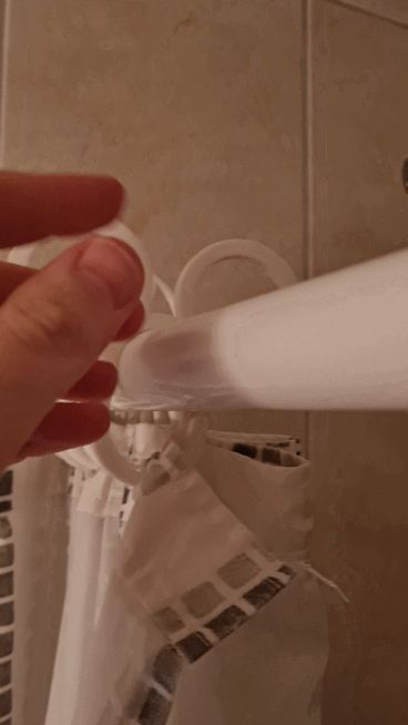 Shower curtain ring with Batman handle