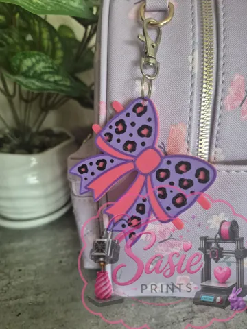 Accesorio para sujetar ligas de cabello: Cheetah Print Bow Hair Tie Holder Keychain — vista de referencia 4