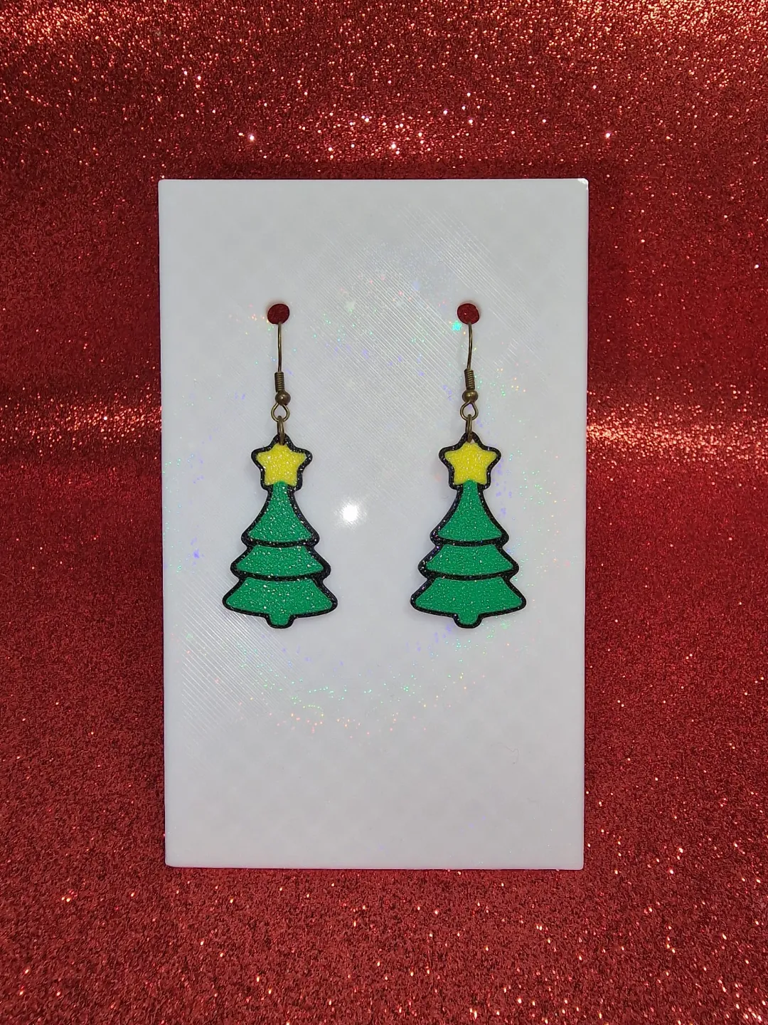 A simple Christmas tree earrings view 3