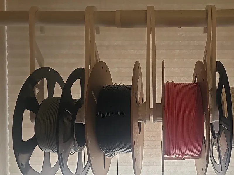 Spool holder with PFTE tubes for reduced friction
