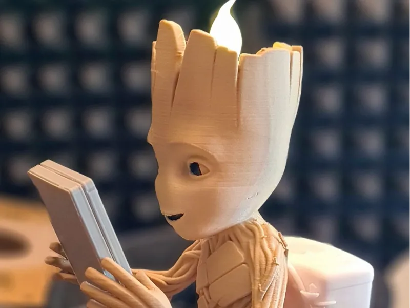Teenager Groot plays Gameboy(tm) Candle holder