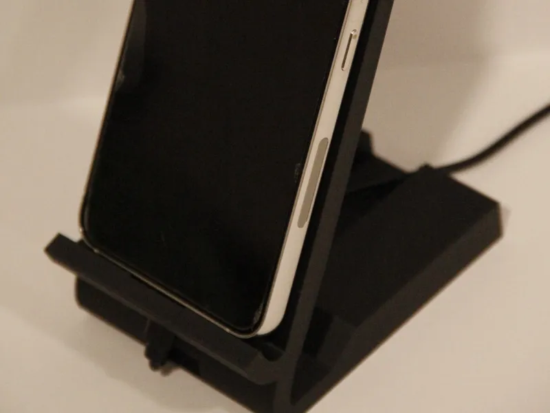 Phone holder with charger slot