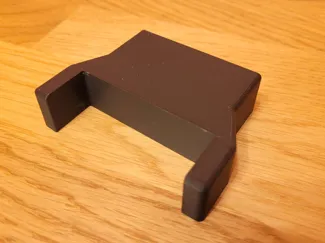 Wall spacer for desk