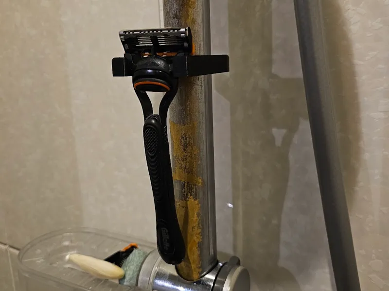 Razor attachment shower rod
