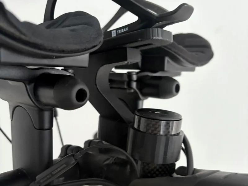 Between the arms bottle cage and Garmin Mount