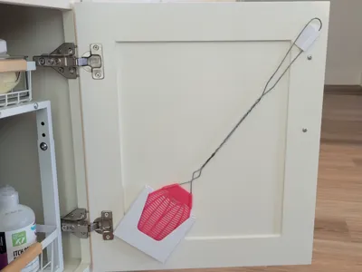 Fly swatter holder