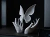 Suspended butterfly (with hands)