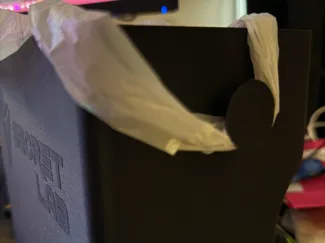 Trash bin with logos and bag holders