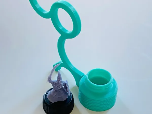 Poignée porte-figurine pour peinture