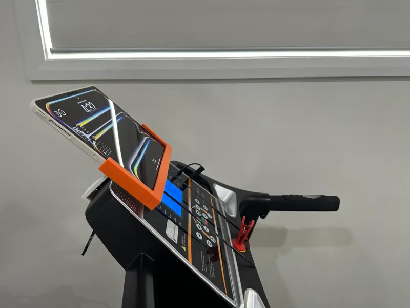 Ipad holder placed on treadmill's head