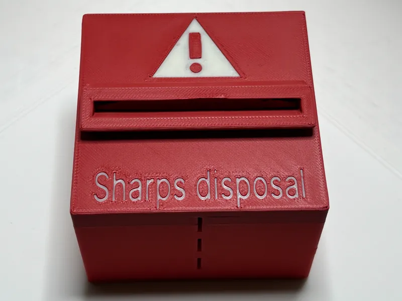 Sharps disposal container