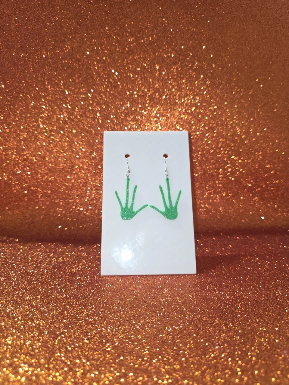Alien hand earrings view 2